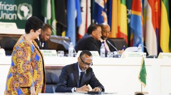 Rwandan President Paul Kagame, chairman of the African Union, signs the African Continental Free Trade Area agreement in Kigali, Rwanda, on March 21. (AP)